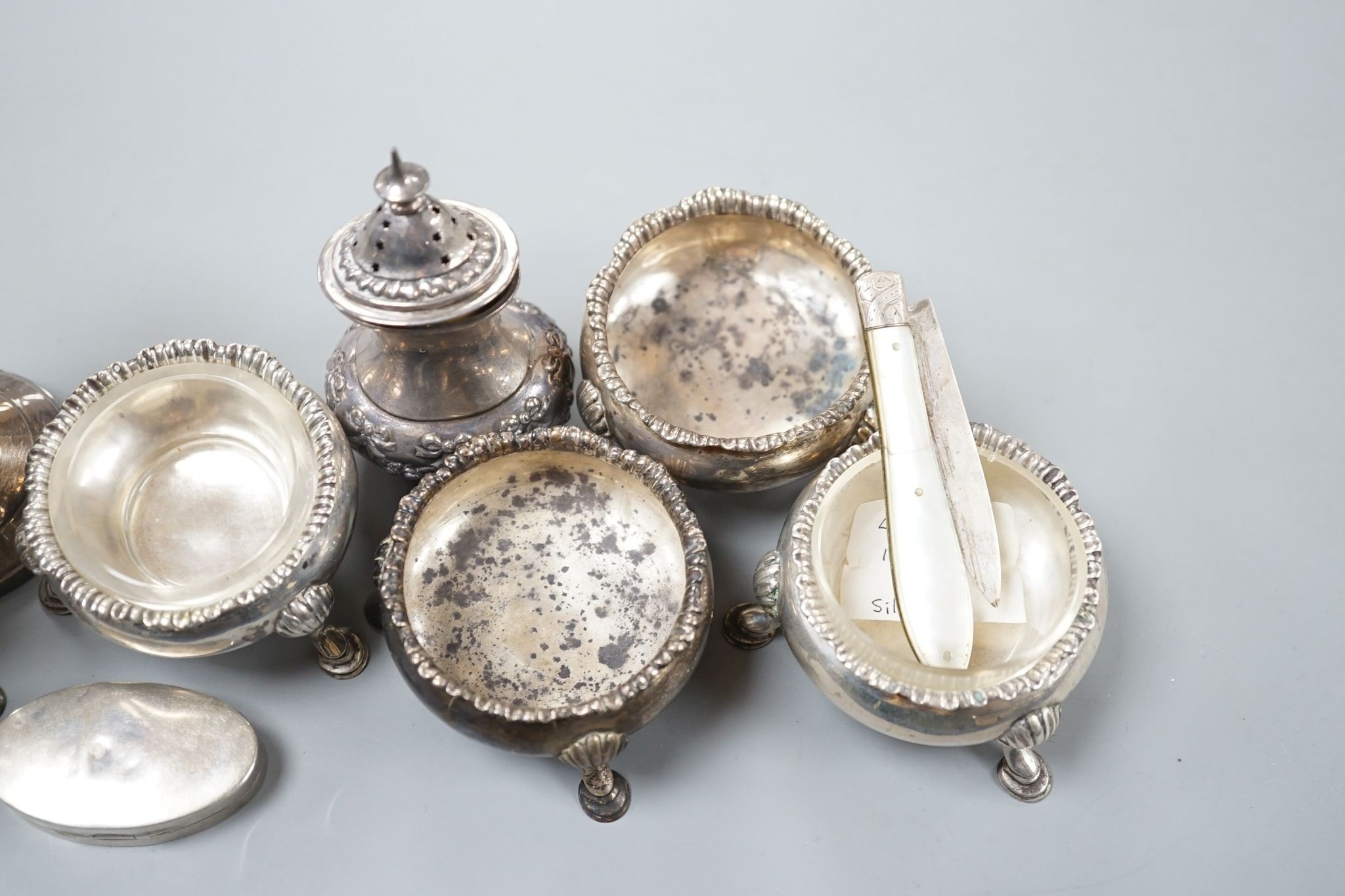 Sundry silver including four Georgian salts, and Art Deco sugar caster, cream jug, condiment and fruit knife.